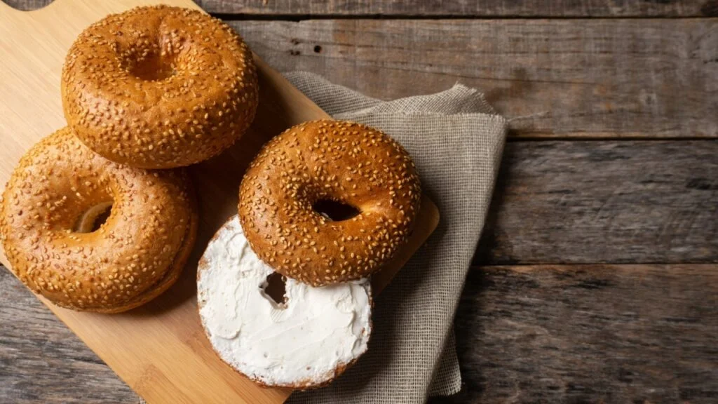 Sesame Bagels With Cheese On Breakfast Board