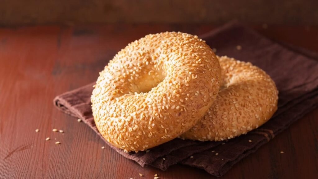 Two bagels topped with sesame seeds