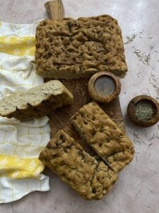 Black pepper focaccia on olivewood tray