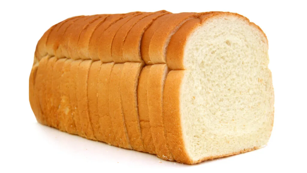 Sandwich white bread on a wooden cutting board