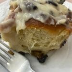 a close up of Chelsea bun with cheese icing