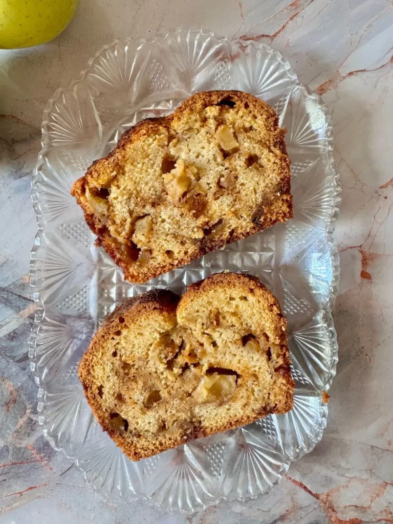 2 slices of apple cinnamon bread on glass plater