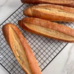 French hoagie rolls in cooling rack