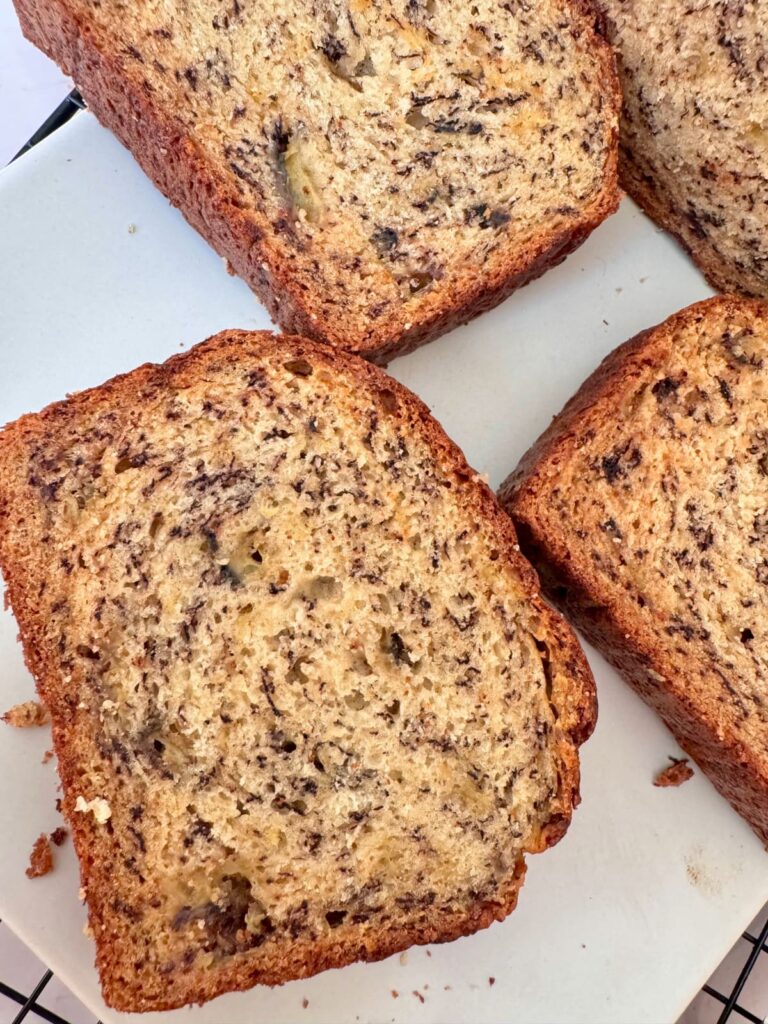 Slice loaf of 3 Ingredient Banana Bread on plate. 