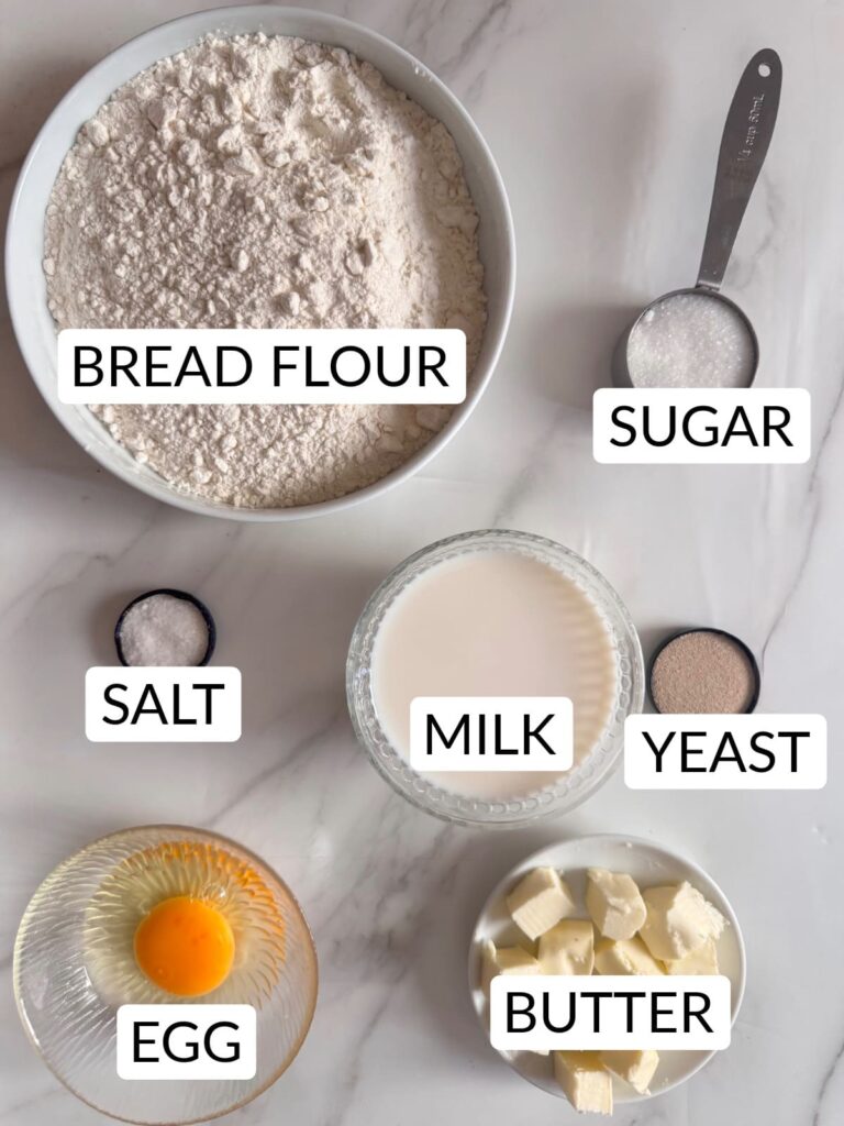 Parker House Roll dough ingredients include milk, egg, yeast, bread flour, sugar, butter, and salt.