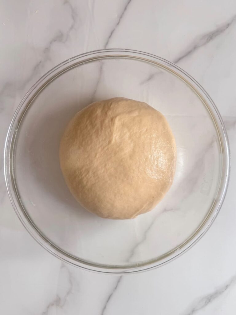 Parker House roll dough in mixing bowl, ready to refrigerate. 