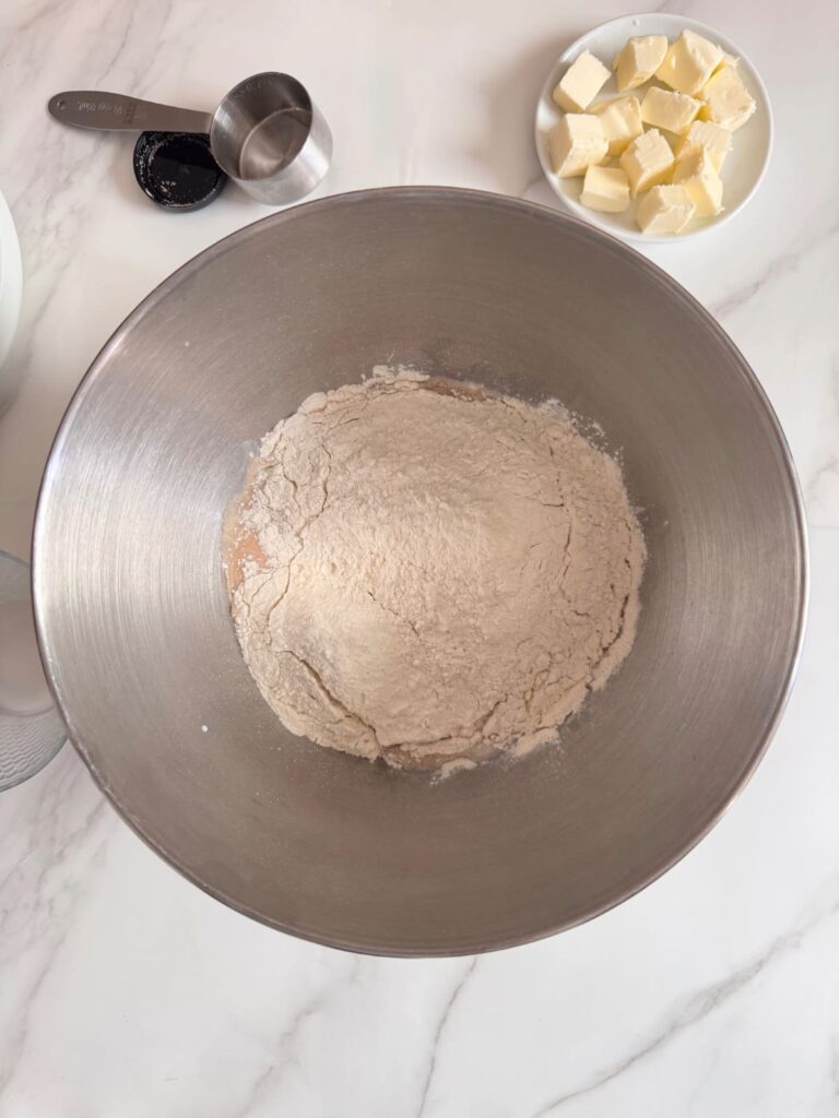 Parker House roll dough ingredients in the mixer bowl except the butter.

