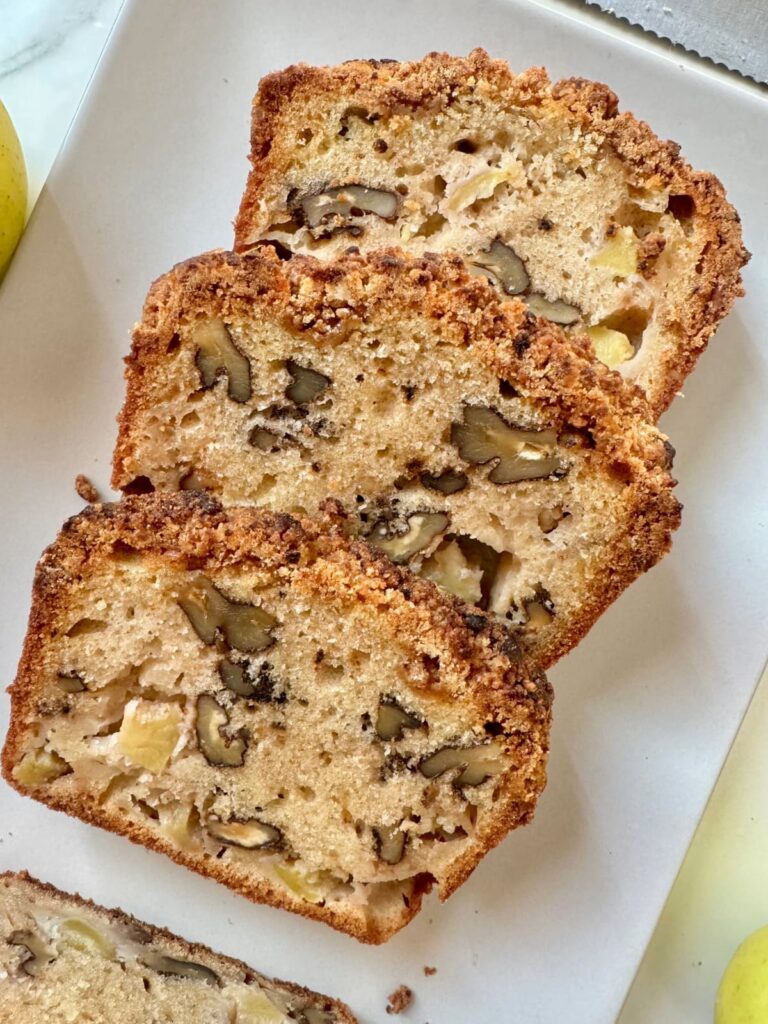 Slices of apple walnut bread on plate.