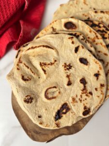 Top photo shows piadina bread on a wooden board.