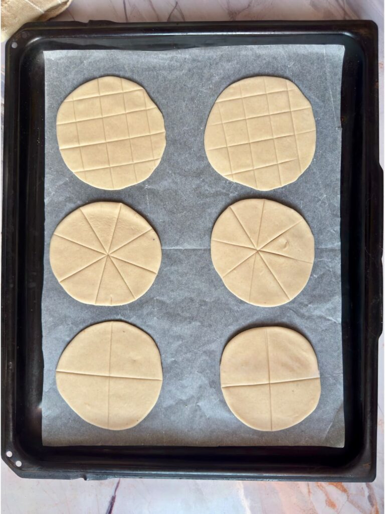 Three different scoring techniques for communion bread.