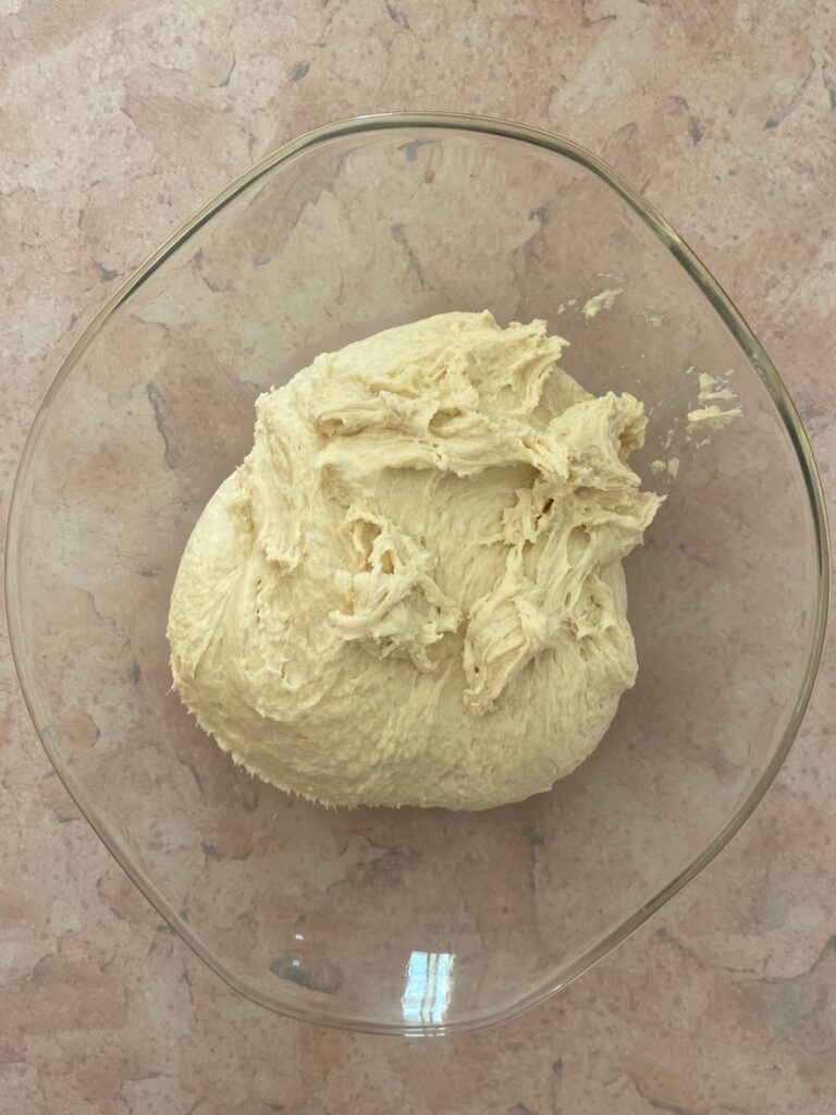 Jerusalem bagel dough in glass mixing bowl.